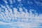 blue sky with white cirrus-cumulus clouds on winter day