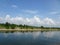 Blue sky white cloud reflection on agricultural canal water