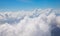 Blue sky with white cloud scenic photo. Cloudscape from airplane window. Skyscape abstraction. Optimistic sunny sky