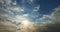 Blue sky, white cloud time lapse of clouds in the sky, the sun shines through the clouds in this photo, dramatic sky clouds