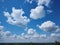 Blue sky with white clouds closeup, natural background photo of nature. Made with Generative AI