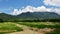 Blue sky and white clouds and green hills