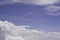 Blue sky, white clouds and jet condensation trail