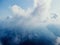 Blue sky with white clouds over calm summer panorama of the sea. Drone aerial view. Abstract aerial nature summer ocean