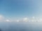 Blue sky with white clouds over calm summer panorama of the sea. Drone aerial view. Abstract aerial nature summer ocean