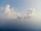 Blue sky with white clouds over calm summer panorama of the sea. Drone aerial view. Abstract aerial nature summer ocean