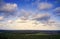 Blue sky with white clouds over the cultural landscape in the north of Germany with forests, meadows and fields, aerial view with