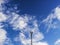 Blue sky and white clouds slowly floating and telephone tower, Thailand