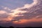 Blue sky with white clouds on sunset. Many little white clouds creating a tranquil weather pattern on the blue background