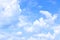 Blue sky with white cloudscape clouds. Beautiful natural clear sky with cumulus clouds. Bright sunny day, meteorology weather