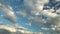 Blue sky with white feather clouds. Panoramic view of the blue sky with clouds in motion. The sun`s rays illuminate the cirrus clo