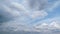 Blue sky with white fluffy clouds during spring. Beautiful peaceful summer or spring cloudy skyscape.