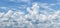 Blue sky and white fluffy clouds in summer. Panorama, wallpaper for design