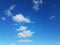 Blue sky with white fluffy cumulus clouds