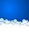 Blue sky with white paper decorative clouds.