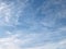 Blue sky with white wispy clouds