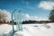 Blue sledge standing in the snow, winter season landscape in the background