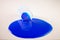 Blue slime spills out of barrel