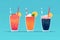 A blue Slushie background with four different drinks with straws and one has a red and white straw