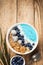 Blue smothie in bowl with granola and berries