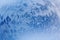 Blue snow background with curl. Snowstorm funnel. Top view inside