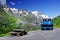 Blue snowplow in a parking on the Grossglockner High Alpine Road in summer time..