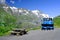 Blue snowplow in a parking on the Grossglockner High Alpine Road in summer time..