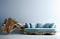 Blue sofa made of tree trunk root over blue empty wall with copy space. Rustic interior design of modern living room. Created with