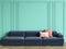 Blue sofa with pink pillows in classic interior with copy space