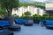 Blue sofas and tables on the restaurant terrace during the pandemic. Recreation area