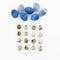 Blue Speckled Easter Egg with quail eggs on white background. Flat lay. Top view. Cloud and rain made of easter eggs, creative con