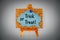 Blue speech bubble with phrase Trick or treat on corkboard on wooden easel