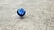 Blue spinning top, toy for children, a type that can rotate on one end, its gravitational center with a gyroscopic effect