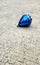 Blue spinning top, toy for children, a type that can rotate on one end, its gravitational center with a gyroscopic effect