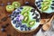 Blue Spirulina and Berry Smoothie Bowl with Blueberries Chocolate and Kiwi