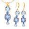 Blue square, round crystal gemstone beads with gold element. Watercolor drawing golden Pendant on chain and earrings on