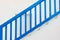 Blue staircase with wooden railing