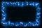 Blue star christams lights on a dark wooden background