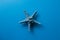 Blue starfish isolated on blue background, summer marine decoration