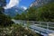 Blue steel bridge over the Verzasca river in the Valle Verzasca