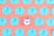 Blue stickers with question marks on a pink background. In the center is a small pink alarm clock. Concept, a matter of