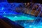 Blue streams of glowing fountain, illuminated fountain at night