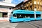 Blue streetcar side view with old residential building in Zagrab, Croatia