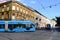 Blue streetcar side view with old residential building in Zagrab, Croatia