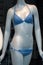 blue stripped bikini on mannequin in fashion store showroom for women