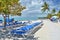 Blue sunbeds on beautiful white sand beach, Bahamas