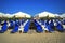 Blue sunbeds on sandy beach