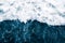 The blue surf of the sea with white waves, splash, foam and bu