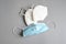 Blue surgical mask and white KN95 or N95 mask for protection pm 2.5 and corona virus  on grey background.