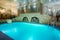 Blue swimming pool in modern spa interior